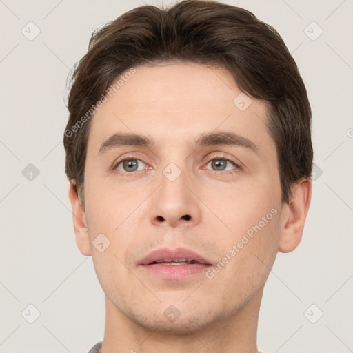 Neutral white young-adult male with short  brown hair and brown eyes