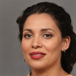 Joyful white adult female with medium  brown hair and brown eyes