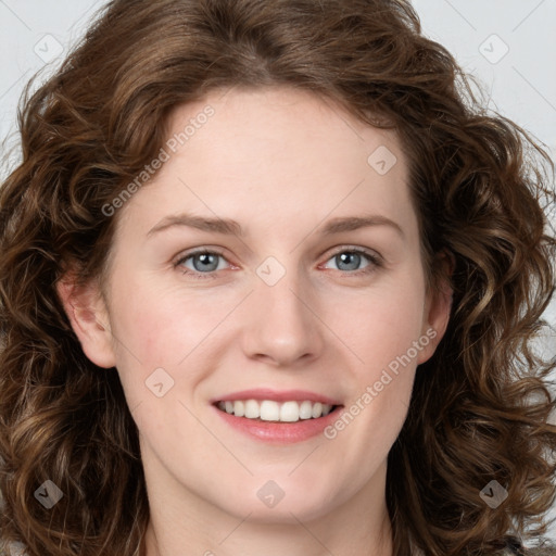 Joyful white young-adult female with long  brown hair and green eyes