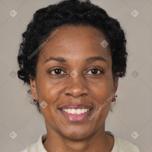 Joyful black adult female with short  brown hair and brown eyes