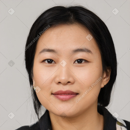 Joyful asian young-adult female with medium  black hair and brown eyes