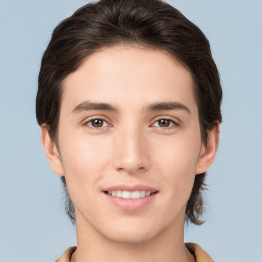 Joyful white young-adult male with medium  brown hair and brown eyes