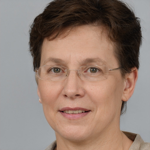 Joyful white adult female with short  brown hair and brown eyes