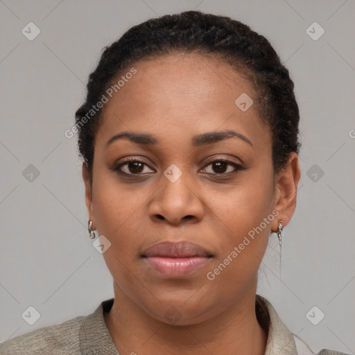 Joyful black young-adult female with short  brown hair and brown eyes