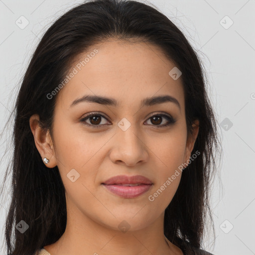 Joyful latino young-adult female with long  brown hair and brown eyes