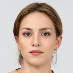 Neutral white young-adult female with medium  brown hair and grey eyes