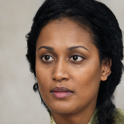 Neutral black young-adult female with long  black hair and brown eyes