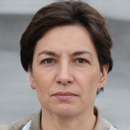 Joyful white adult female with short  brown hair and grey eyes