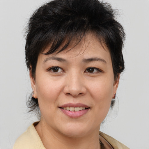 Joyful white adult female with medium  brown hair and brown eyes