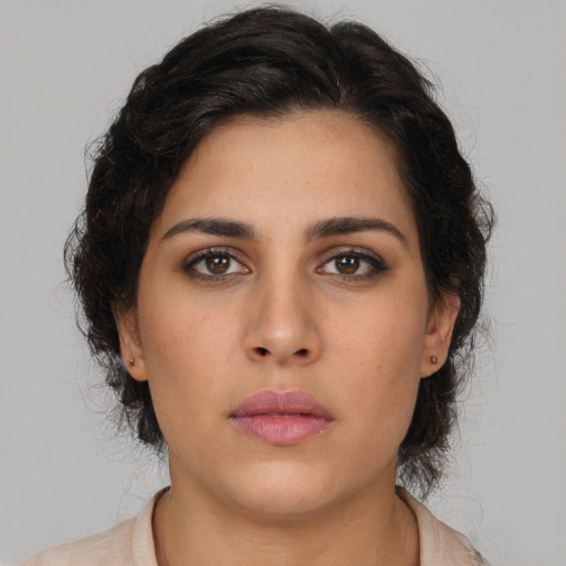 Neutral latino young-adult female with long  brown hair and brown eyes