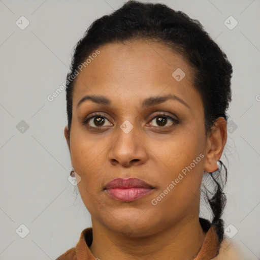 Joyful black young-adult female with short  brown hair and brown eyes