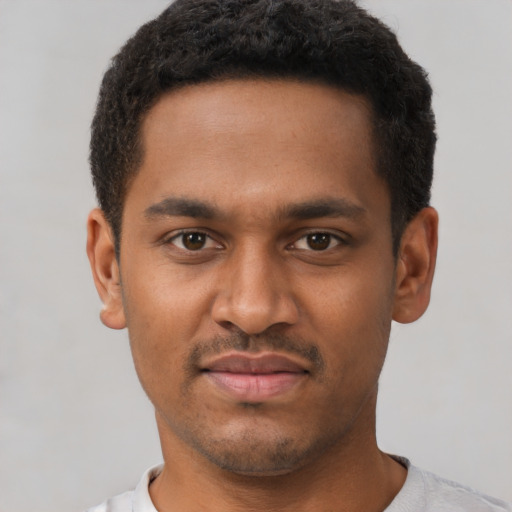 Neutral black young-adult male with short  brown hair and brown eyes