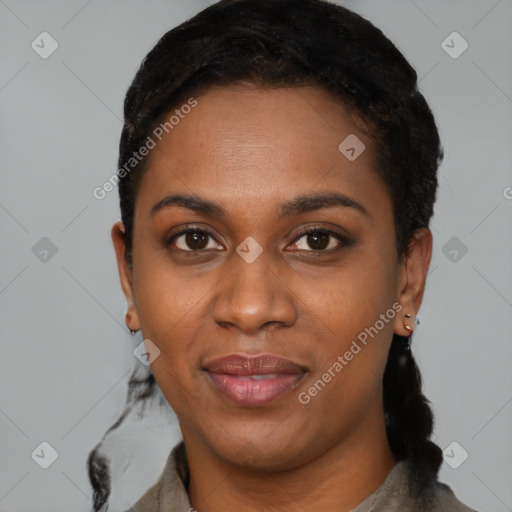 Joyful black young-adult female with short  black hair and brown eyes