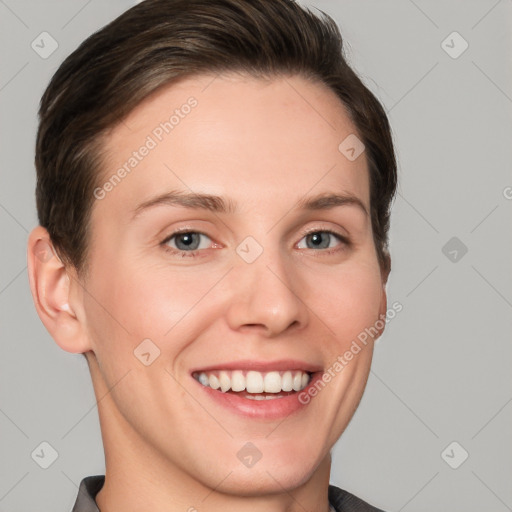 Joyful white young-adult female with short  brown hair and grey eyes