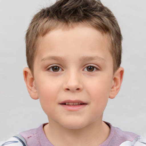 Joyful white child male with short  brown hair and brown eyes