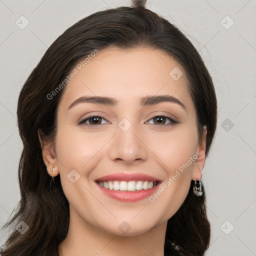 Joyful white young-adult female with long  brown hair and brown eyes