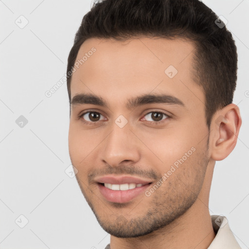 Joyful white young-adult male with short  brown hair and brown eyes