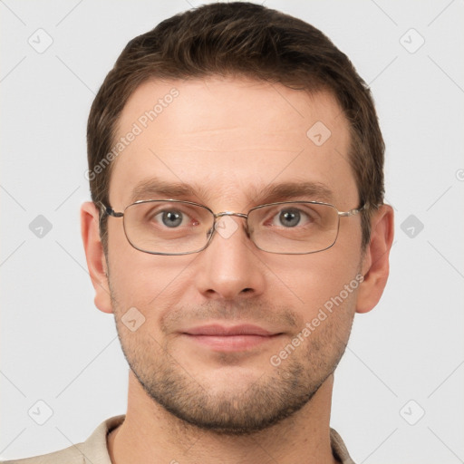 Joyful white young-adult male with short  brown hair and grey eyes