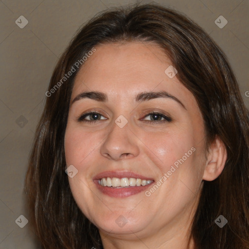 Joyful white adult female with medium  brown hair and brown eyes