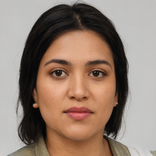 Neutral latino young-adult female with medium  brown hair and brown eyes