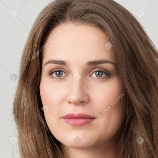 Joyful white young-adult female with long  brown hair and green eyes