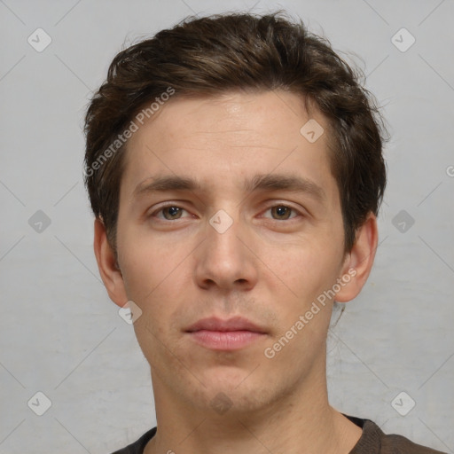 Neutral white young-adult male with short  brown hair and brown eyes