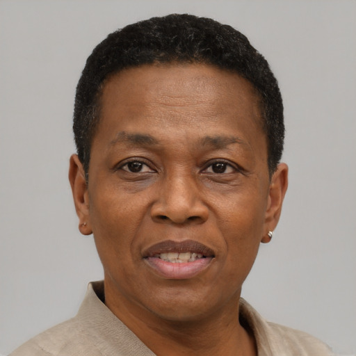 Joyful black adult male with short  brown hair and brown eyes