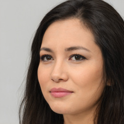 Joyful asian young-adult female with long  brown hair and brown eyes