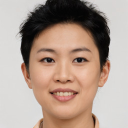 Joyful asian young-adult female with short  brown hair and brown eyes