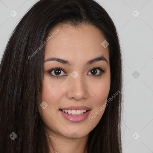 Joyful asian young-adult female with long  brown hair and brown eyes