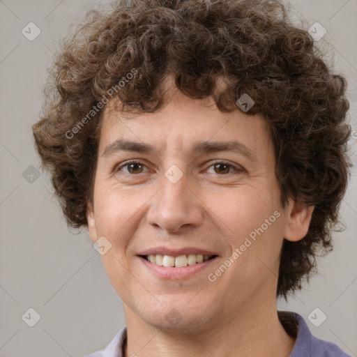 Joyful white young-adult male with medium  brown hair and brown eyes