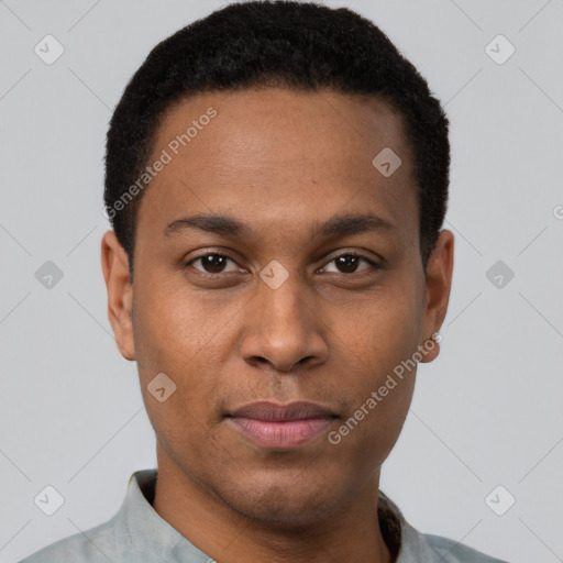 Joyful black young-adult male with short  brown hair and brown eyes