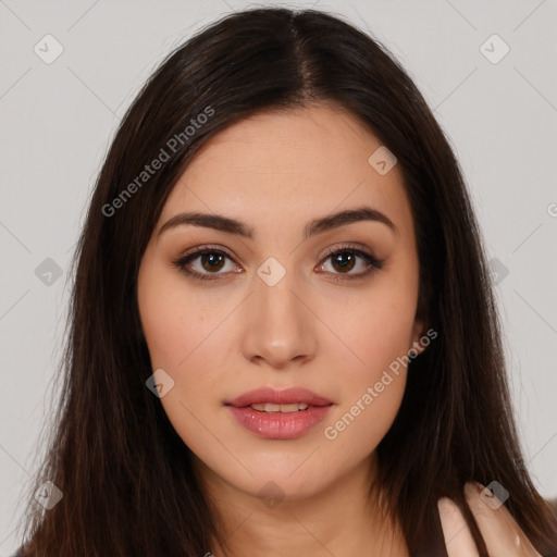 Joyful white young-adult female with long  brown hair and brown eyes