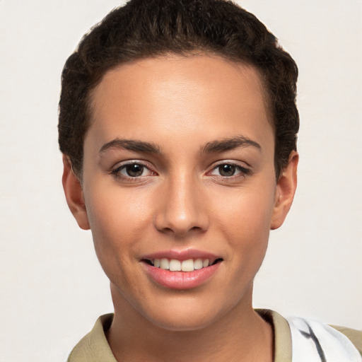 Joyful white young-adult female with short  brown hair and brown eyes