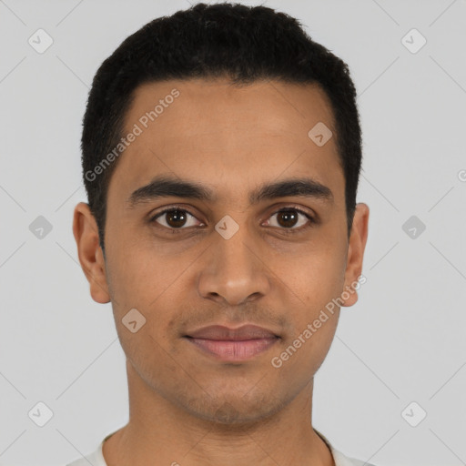 Joyful latino young-adult male with short  brown hair and brown eyes