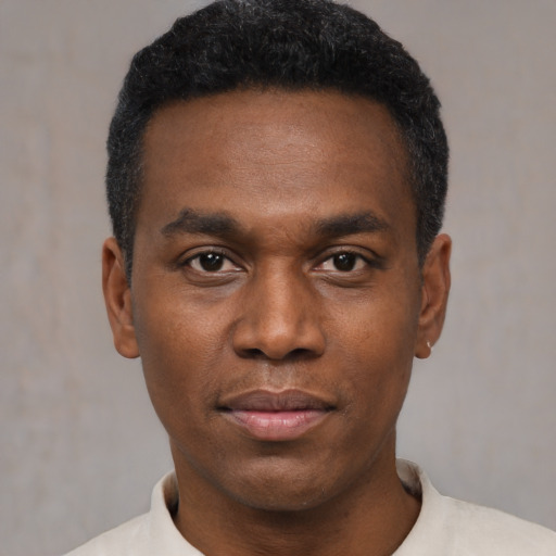 Neutral black young-adult male with short  black hair and brown eyes