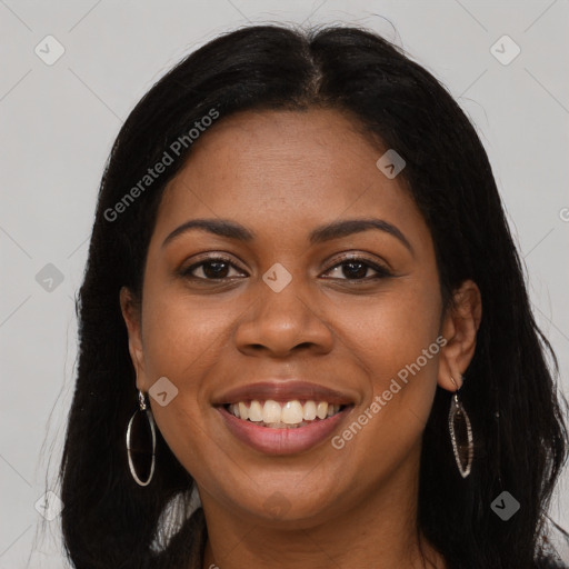 Joyful black young-adult female with long  brown hair and brown eyes