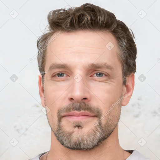 Neutral white adult male with short  brown hair and brown eyes