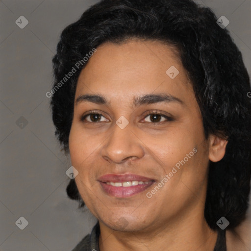 Joyful latino young-adult female with long  black hair and brown eyes