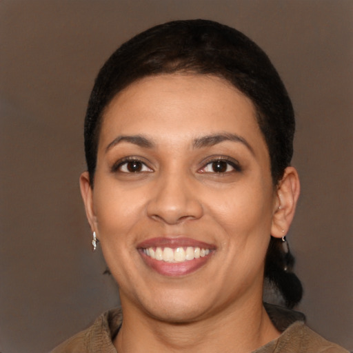 Joyful latino young-adult female with short  brown hair and brown eyes