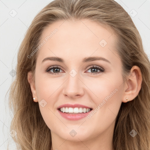 Joyful white young-adult female with long  brown hair and blue eyes