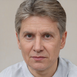 Joyful white middle-aged male with short  brown hair and brown eyes