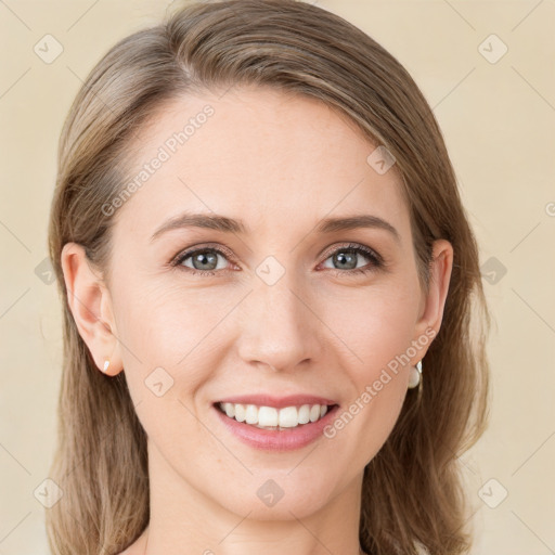 Joyful white young-adult female with long  brown hair and green eyes