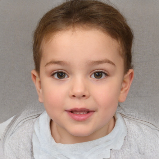 Joyful white child female with short  brown hair and blue eyes