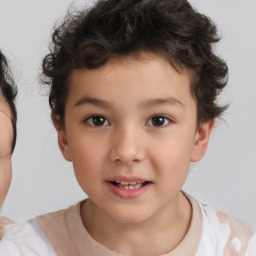 Joyful white child male with short  brown hair and brown eyes