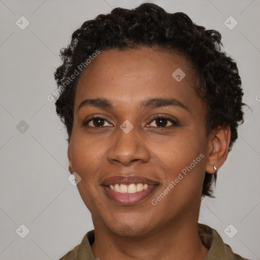 Joyful black young-adult female with short  brown hair and brown eyes