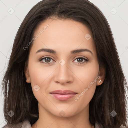 Joyful white young-adult female with long  brown hair and brown eyes