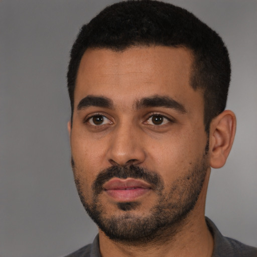 Neutral black young-adult male with short  black hair and brown eyes