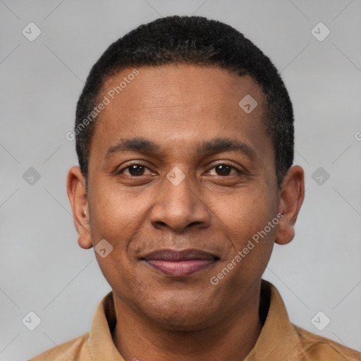 Joyful latino adult male with short  black hair and brown eyes