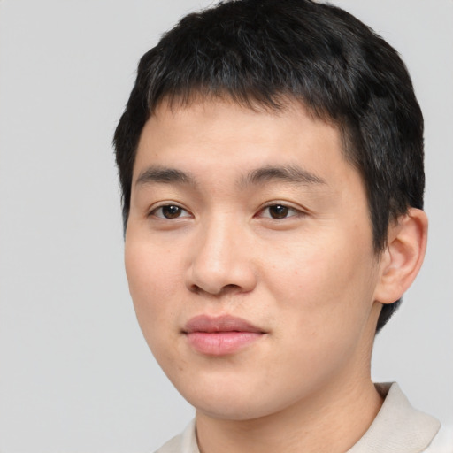 Joyful asian young-adult male with short  black hair and brown eyes